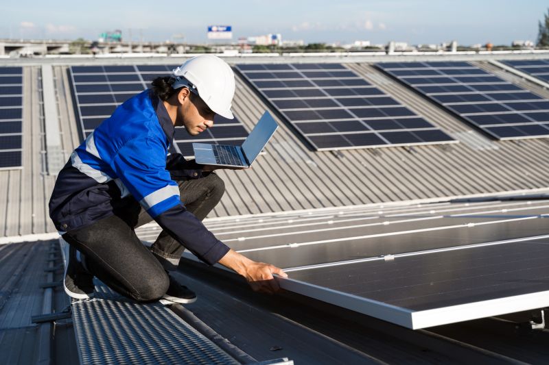 Technician Mounting Solar Panels